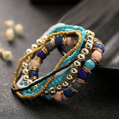 Multi-layer beaded elastic bracelet with teal, gold, dark blue, and purple beads