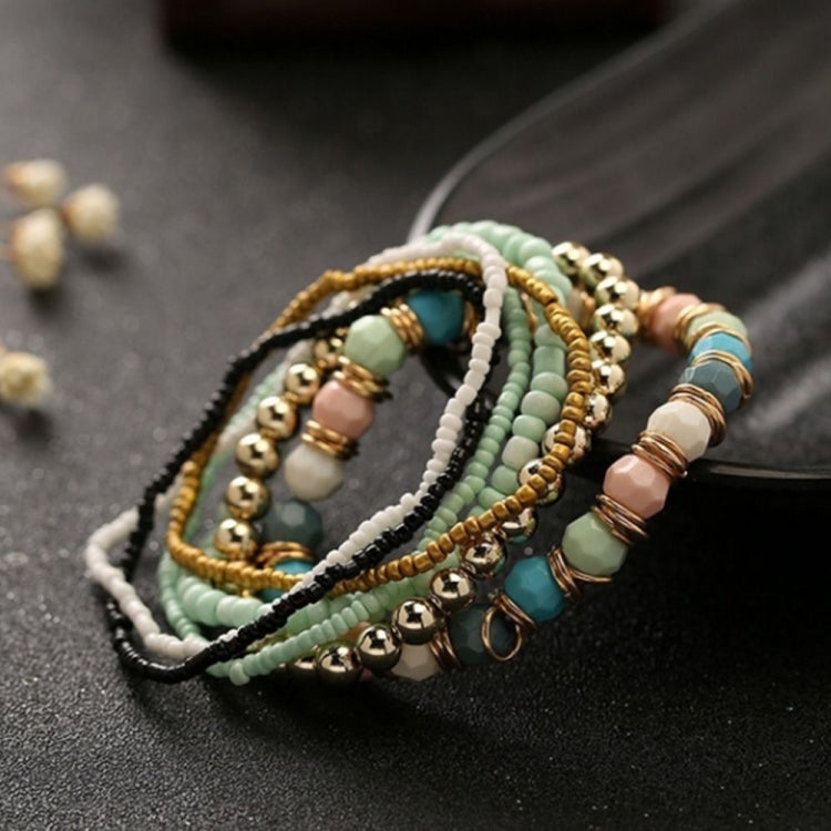 Multi-layer beaded elastic bracelet with mint green, white, gold, and teal beads