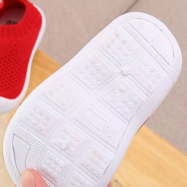 Infant toddler shoe outsole with raised grip pattern and white rubber tread