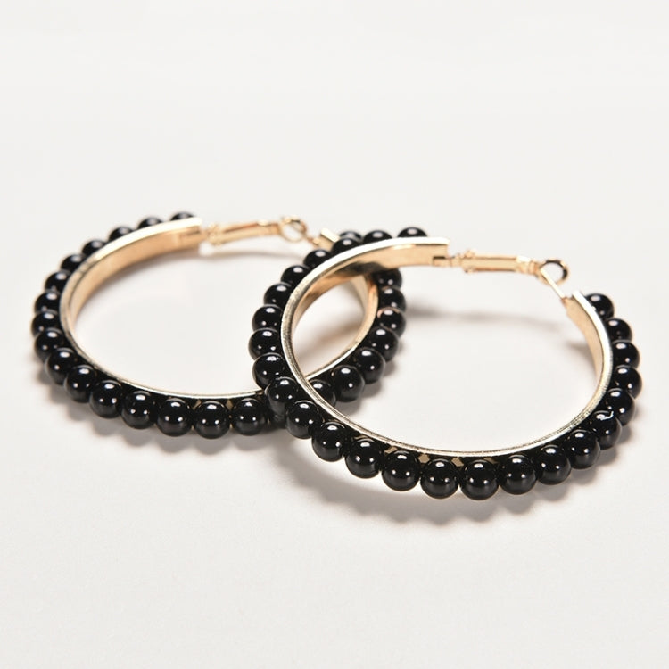 Girls hoop pearl earrings pair with gold oval hoops and black bead fringe