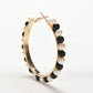Girls hoop pearl earrings with gold oval hoop and black-and-white bead fringe
