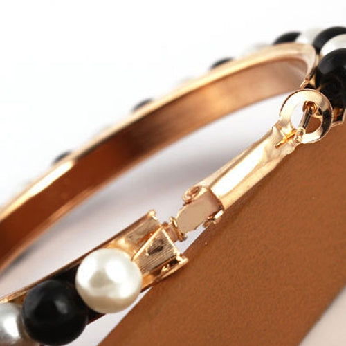 Girls hoop pearl earrings clasp detail with black and white beads on gold hoop
