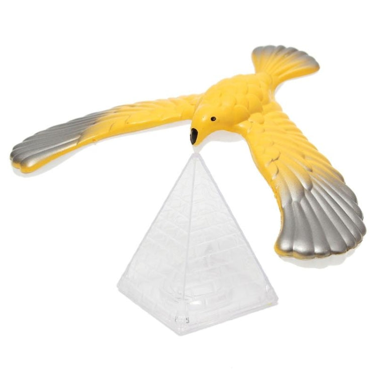 Yellow and gray eagle balance bird toy with clear triangular base