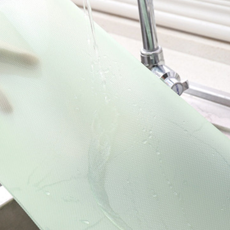 Light green waterproof drawer pad mat surface with water droplets near faucet