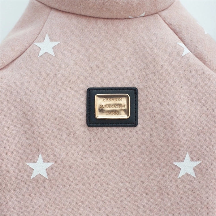 Pink pet sweater close-up with star print and front logo patch on the chest