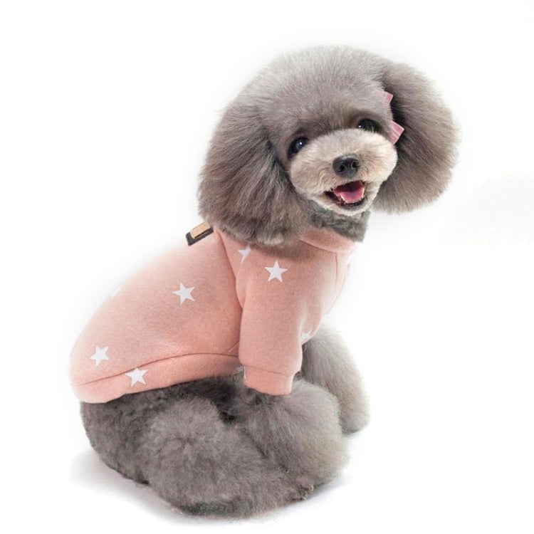Pink star-pattern pet sweater on a small dog, plush trim at neck and legs