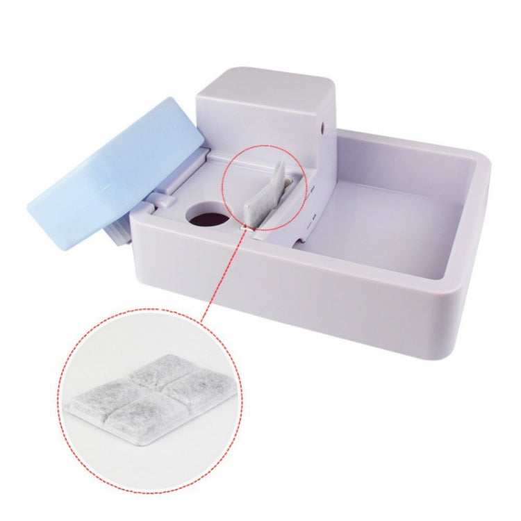 Automatic pet water dispenser with removable filter pad shown in close-up
