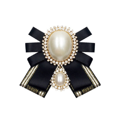 Black satin bow brooch with oval pearl cabochon and rhinestone trim, double pearl detail