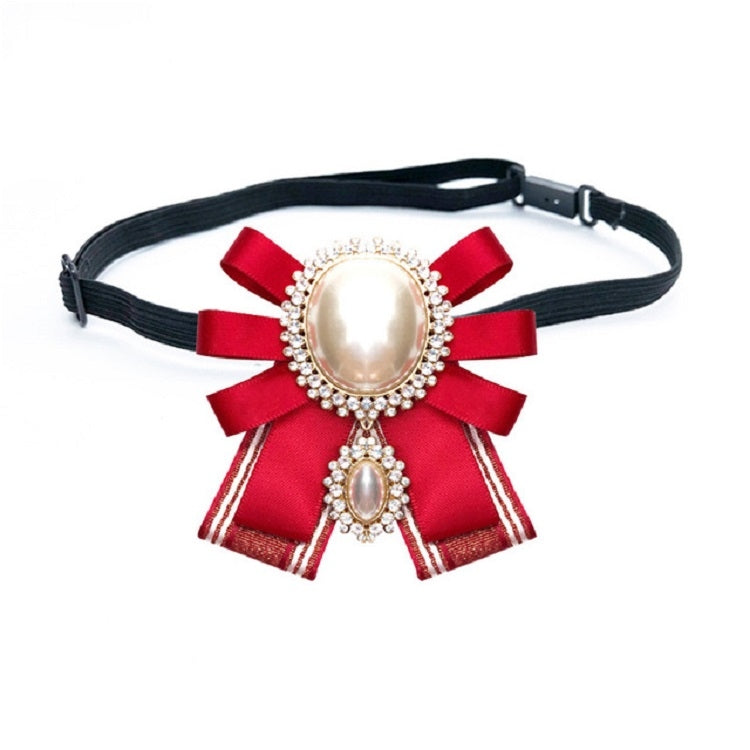 Red bow brooch belt accessory with oval pearl center and small pearl drop, rhinestone trim