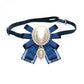 Pearl bow on black buckle belt, blue striped ribbons with oval center and small dangling pearl