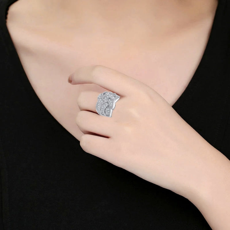 Close-up of silver-tone square zircon ring on finger