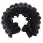 Black lace-edged faux collar close-up with ruffled center and pearl bead accents