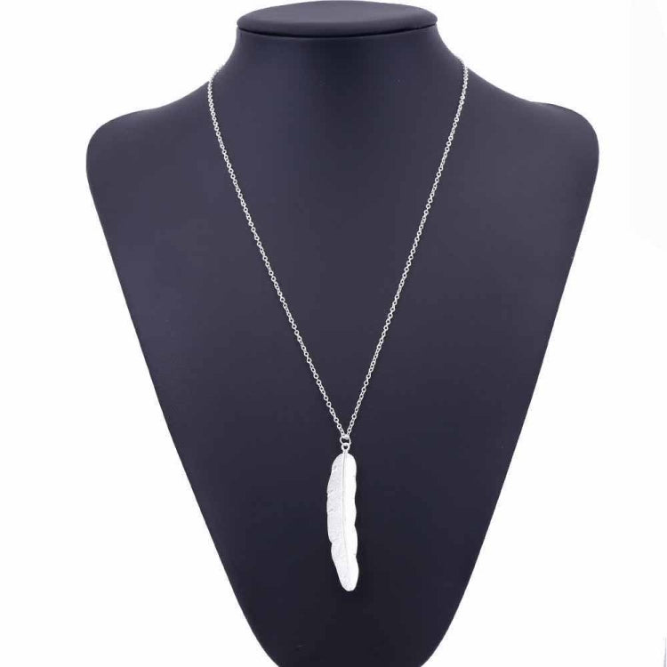 Silver long feather pendant necklace on mannequin