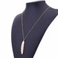 Gold long feather pendant necklace on mannequin, angled view