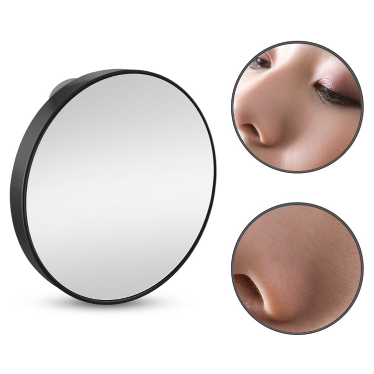 Black round suction cup makeup mirror with reflective lens and magnified face closeups