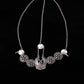 Silver forehead chain with long links, round medallion coins, and central pendant with tassel-like drops