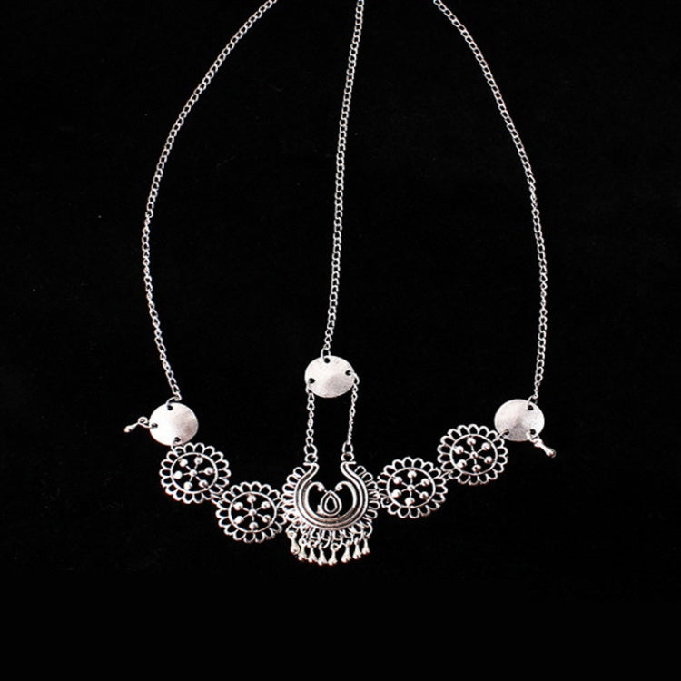 Silver forehead chain with long links, round medallion coins, and central pendant with tassel-like drops
