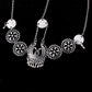 Silver head chain with large central paisley pendant and round coin medallions on five links