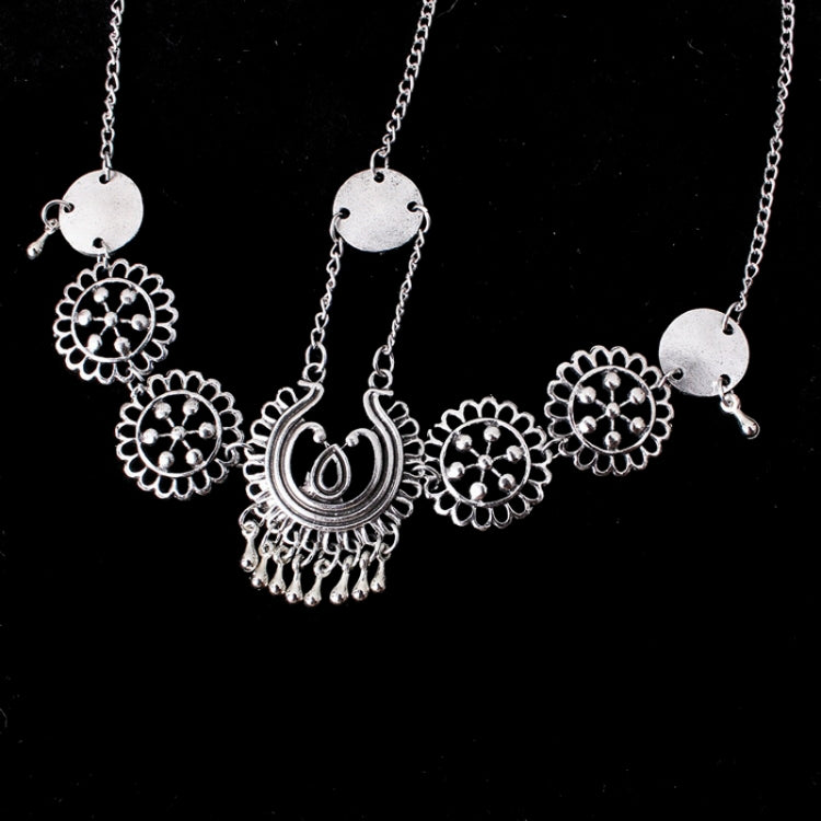 Silver head chain with large central paisley pendant and round coin medallions on five links