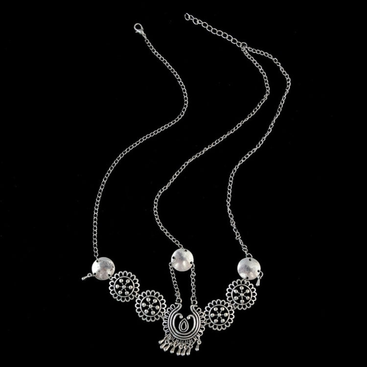 Silver multi-strand head chain with dangling round coin charms and central paisley drop