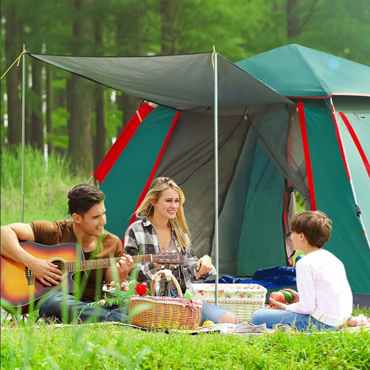 Dark green automatic camping tent with red trim, open door, and raised canopy