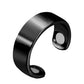 Glossy black open cuff ring with three magnetic disc accents on the inner band