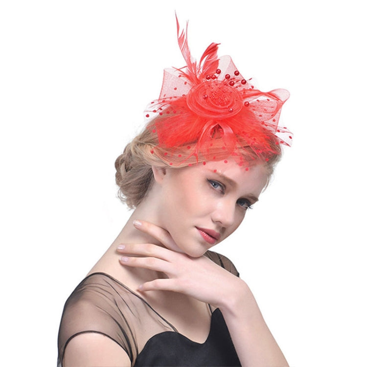 Red mesh bridal fascinator with feathered beaded flower and veil netting
