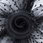 Black mesh fascinator with curled rosette and pearl bead accents
