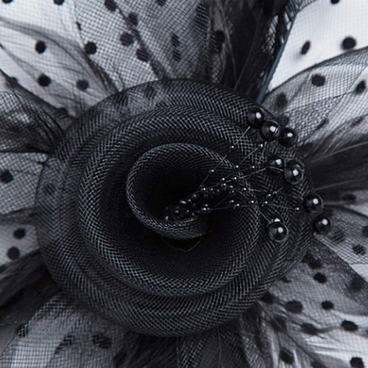 Black mesh fascinator with curled rosette and pearl bead accents
