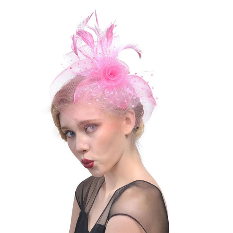 Pink mesh hair fascinator with rosette flower and feather accents