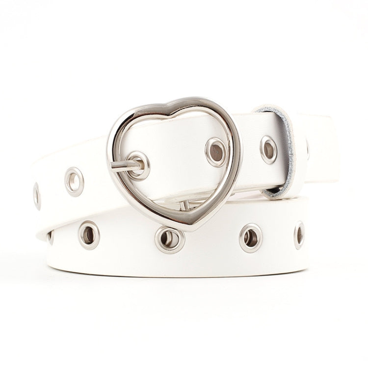 White narrow leather belt with silver heart buckle and round grommet studs