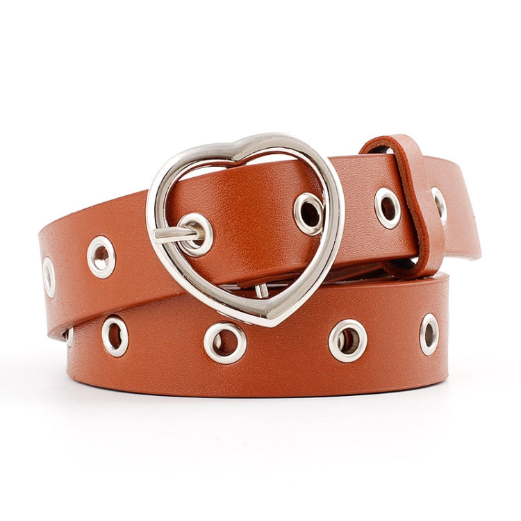 Brown narrow leather belt with silver heart buckle and round grommet studs