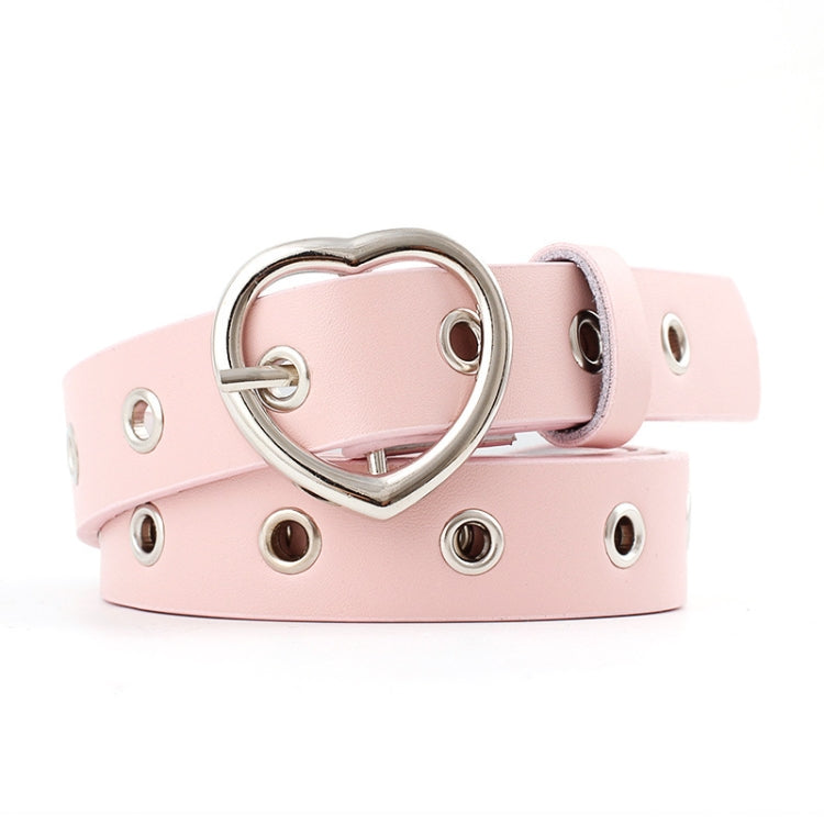 Light pink narrow leather belt with silver heart buckle and round grommet studs