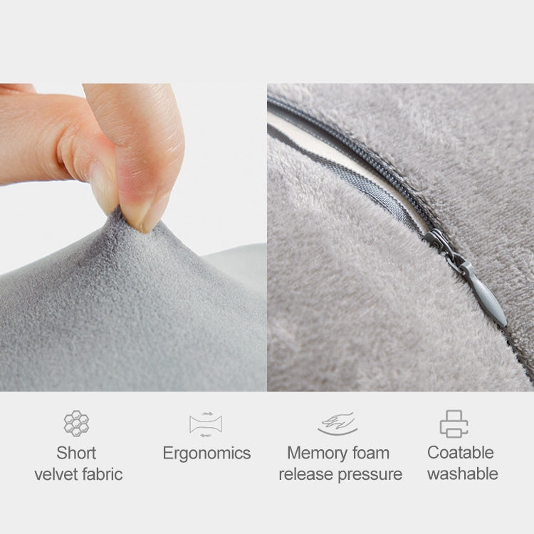 Light gray fabric leg pillow cushion with visible zipper seam