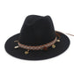 Black felt wide-brim hat with patterned band and dangling coin charm tassel trim
