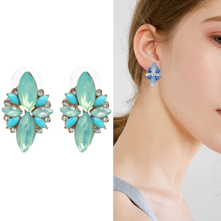 Teal crystal flower stud earrings with five petal-style stones and small clear accents