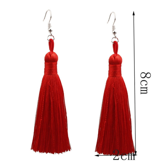 Pair of red tassel earrings with silver-tone hooks, about 8 cm long.