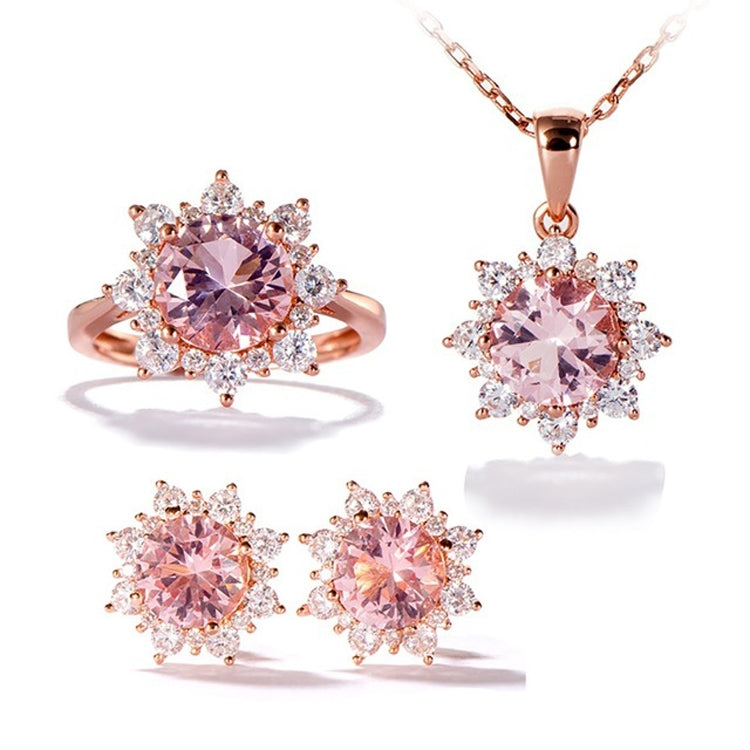 Rose-gold set with pink gemstone ring, matching pendant necklace, and two pink stud earrings.