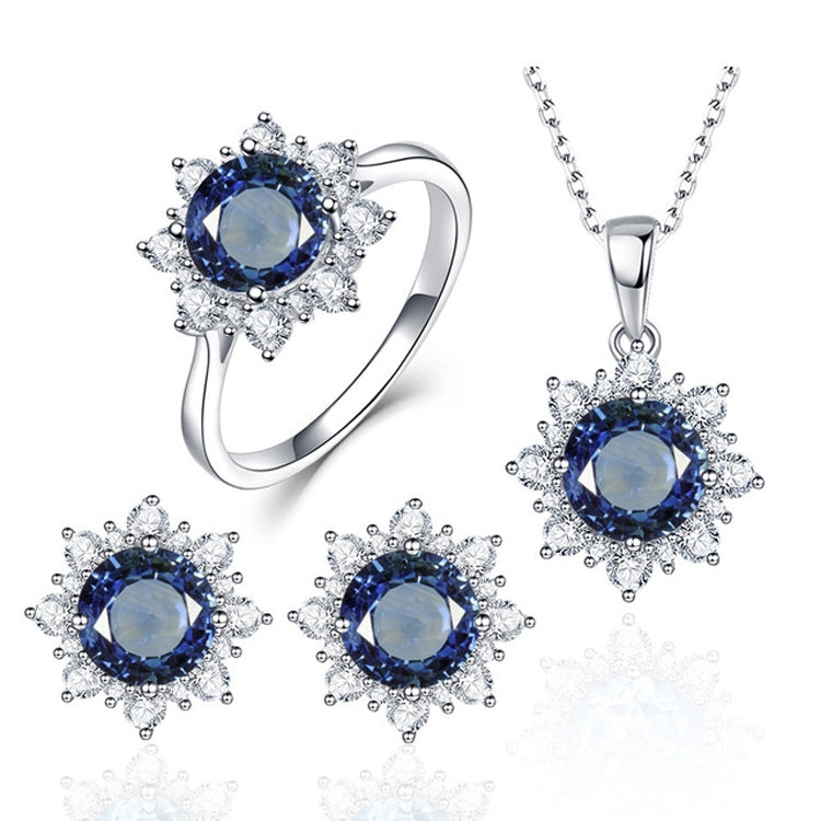 Sapphire-blue round gemstone ring, pendant necklace, and three matching round stud earrings.