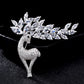 Crystal deer brooch, arched standing design with sparkling stones and leaf-like antlers