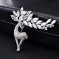 Crystal deer brooch on black fabric, full standing deer with clustered rhinestone antlers
