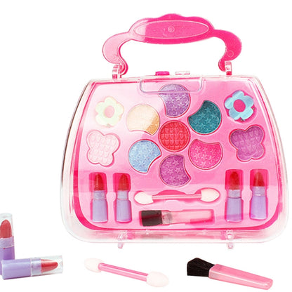 Kids' pink portable makeup toy set in clear heart-shaped case with accessories