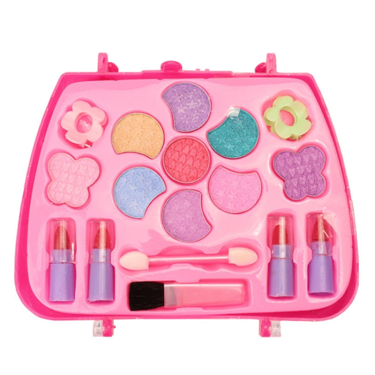 Pink makeup cosmetics toy palette with colorful molded eyeshadow and lip accessories