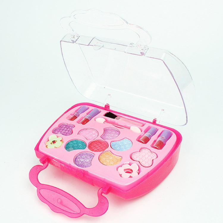 Open pink heart-shaped makeup toy case with colorful cosmetic pan inserts