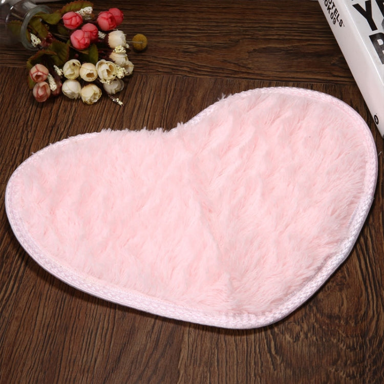 Light pink heart-shaped bath mat with soft shag pile and non-slip edge trim.