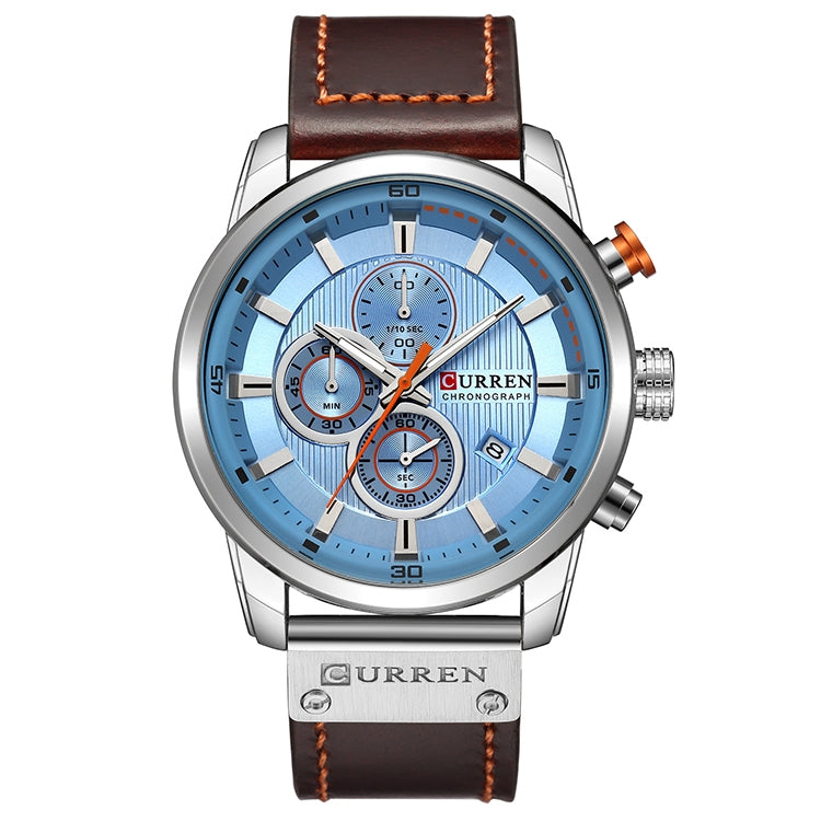 Men’s chronograph wristwatch with blue dial, silver case, and brown leather strap