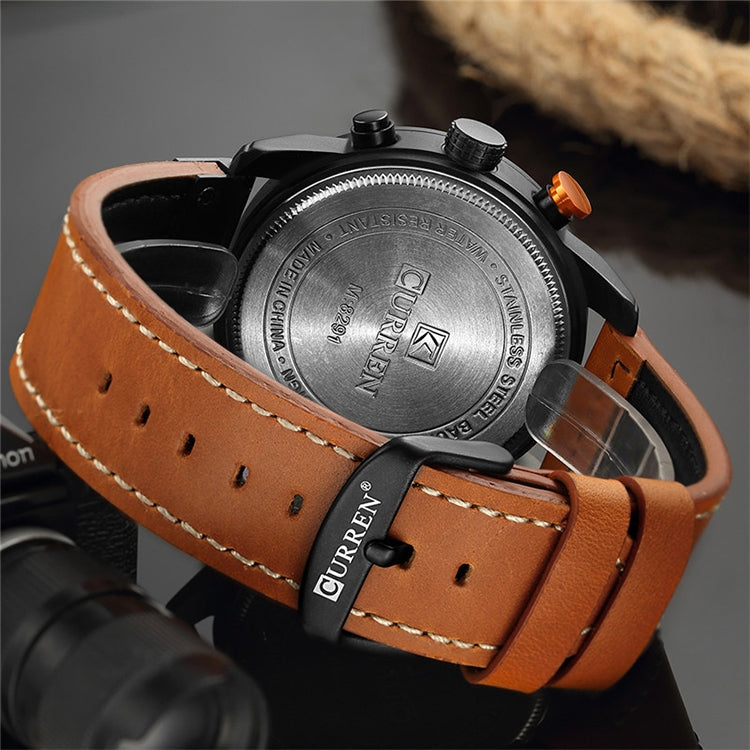 Men’s chronograph watch caseback with crown, black-brown leather strap and orange stitching