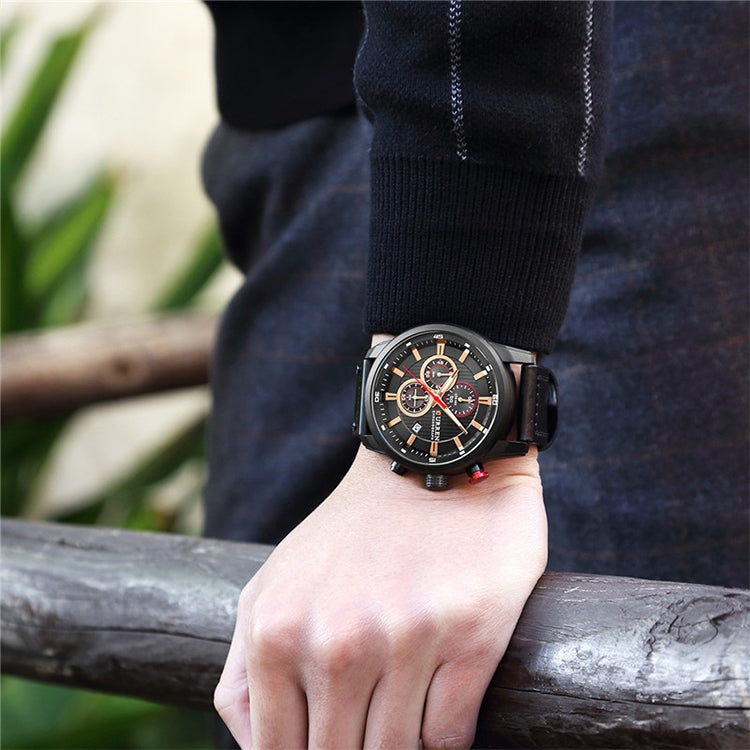 Men’s chronograph wristwatch with black case, dark dial, and black leather strap
