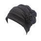 Dark gray chemo cap with pleated crown and large fabric rosette flower
