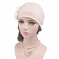 Light pink chemo cap with side fabric rose detail and smooth draped crown